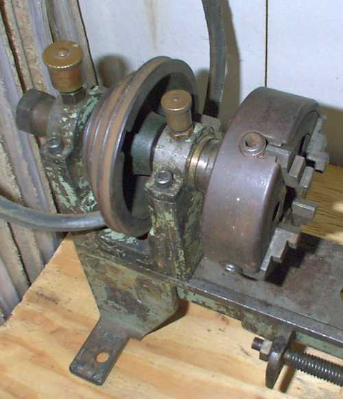 Lathe headstock with bearings, pully and 4 jaw chuck